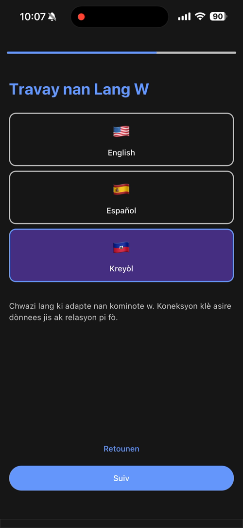 Onboarding language picker mid-selection, showing the entire screen re-rendered in Kreyòl after tapping "Kreyòl"