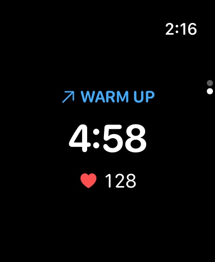 Warm-up on the watch: the interval name, time remaining, and heart rate